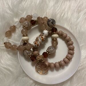 3 beautiful nude/brown/beige bead +charm bracelets